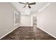 Bright living room with wood-look floors and ceiling fan at 861 Zinnia Cir, Henderson, NV 89015