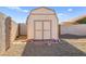 Tan colored storage shed in backyard at 861 Zinnia Cir, Henderson, NV 89015