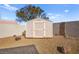 Tan colored storage shed in the backyard at 861 Zinnia Cir, Henderson, NV 89015