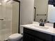 Modern bathroom with a white vanity, black fixtures, and a walk-in shower at 8976 Sweet Chestnut Ln, Las Vegas, NV 89178