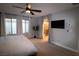 Main bedroom with ensuite bathroom and large windows at 8976 Sweet Chestnut Ln, Las Vegas, NV 89178