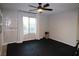 Bright bedroom with large window, ceiling fan, and space for exercise at 8976 Sweet Chestnut Ln, Las Vegas, NV 89178