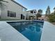 Inviting swimming pool with surrounding patio and modern house in background at 8976 Sweet Chestnut Ln, Las Vegas, NV 89178