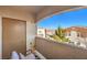 Private balcony with mountain views and seating area at 9303 Gilcrease Ave # 2177, Las Vegas, NV 89149