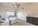 Spacious bedroom with a dresser and sliding door to balcony at 9303 Gilcrease Ave # 2177, Las Vegas, NV 89149