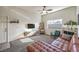 Living room featuring a brown leather sectional sofa and a fireplace at 9303 Gilcrease Ave # 2177, Las Vegas, NV 89149