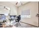 Home office with built-in desk and two monitors at 9303 Gilcrease Ave # 2177, Las Vegas, NV 89149