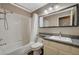 Bathroom with single sink, granite countertop, and bathtub at 9612 World Cup Dr, Las Vegas, NV 89117