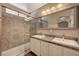 Bathroom with double sinks, granite countertop, and a walk-in shower at 9612 World Cup Dr, Las Vegas, NV 89117