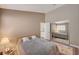 Well-lit bedroom with mirrored closet and patterned rug at 9612 World Cup Dr, Las Vegas, NV 89117