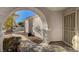 View through arched entryway to the front door at 9612 World Cup Dr, Las Vegas, NV 89117