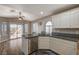 Kitchen features granite counters, white cabinets, and stainless steel appliances at 9612 World Cup Dr, Las Vegas, NV 89117