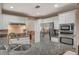 Modern kitchen, granite counters, stainless steel appliances and double sink at 9612 World Cup Dr, Las Vegas, NV 89117