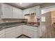 Bright kitchen with granite countertops and white cabinets at 9612 World Cup Dr, Las Vegas, NV 89117