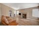 Living room with fireplace and wood-look floors at 9612 World Cup Dr, Las Vegas, NV 89117