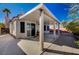 Covered patio with gravel yard and mature trees at 9612 World Cup Dr, Las Vegas, NV 89117