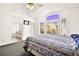 Main bedroom with ensuite bathroom and large window at 9700 Port Orange Ln, Las Vegas, NV 89134