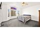 Spacious bedroom with carpeted floor and large window at 9700 Port Orange Ln, Las Vegas, NV 89134