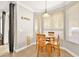 Kitchen breakfast nook with wood chairs and table, ample natural light at 9700 Port Orange Ln, Las Vegas, NV 89134