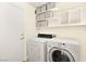 Bright laundry room with washer, dryer, and ample storage at 9700 Port Orange Ln, Las Vegas, NV 89134