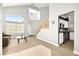 Living room with kitchen peek, vaulted ceilings, and tile floors at 9700 Port Orange Ln, Las Vegas, NV 89134