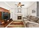 Gathering room featuring a fireplace and built-in shelving at 9700 Port Orange Ln, Las Vegas, NV 89134