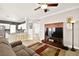 Open living room with kitchen island and barstools at 9700 Port Orange Ln, Las Vegas, NV 89134