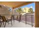 Private patio with seating area and access to backyard at 9700 Port Orange Ln, Las Vegas, NV 89134