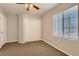 Bedroom with carpet flooring and large window at 9802 Twin Mill St, Las Vegas, NV 89178