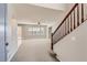 Bright and spacious entryway with staircase and carpet flooring at 9802 Twin Mill St, Las Vegas, NV 89178