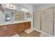 Double vanity bathroom with a large shower and updated flooring at 1021 Bourbon St, Pahrump, NV 89048