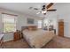 Large bedroom with king-size bed and ensuite bathroom at 10350 Blue Ginger Dr, Las Vegas, NV 89135