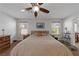 Bright bedroom with king-size bed and ceiling fan at 10350 Blue Ginger Dr, Las Vegas, NV 89135