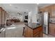 Kitchen with island, stainless steel appliances, and wood cabinets at 10350 Blue Ginger Dr, Las Vegas, NV 89135