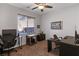 Bright home office featuring a desk, chair, and large window at 10350 Blue Ginger Dr, Las Vegas, NV 89135