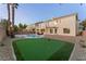 Spacious backyard with putting green and refreshing pool at 10825 Bernini Dr, Las Vegas, NV 89141