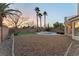 Spacious backyard with pool, putting green, and patio at 10825 Bernini Dr, Las Vegas, NV 89141