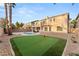 Landscaped backyard with putting green and sparkling pool at 10825 Bernini Dr, Las Vegas, NV 89141