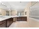 Large bathroom with double vanity, walk-in shower, and soaking tub at 10825 Bernini Dr, Las Vegas, NV 89141