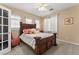 Bright bedroom with a ceiling fan and double door access at 10825 Bernini Dr, Las Vegas, NV 89141
