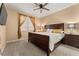 Bedroom with dark-wood bed frame and nightstands at 10825 Bernini Dr, Las Vegas, NV 89141