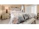 Main bedroom with mirrored headboard and floral bedding at 10825 Bernini Dr, Las Vegas, NV 89141