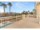 Private deck overlooking pool, landscaped yard, and neighborhood at 10825 Bernini Dr, Las Vegas, NV 89141