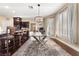Bright dining room with glass table and seating for six at 10825 Bernini Dr, Las Vegas, NV 89141