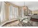 Elegant dining area with glass-top table and neutral decor at 10825 Bernini Dr, Las Vegas, NV 89141