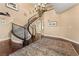 Elegant entryway showcasing a curved staircase and chandelier at 10825 Bernini Dr, Las Vegas, NV 89141