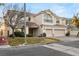 Two-story house with three-car garage and landscaping at 10825 Bernini Dr, Las Vegas, NV 89141