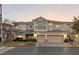 Two-story house with three-car garage and landscaped yard at 10825 Bernini Dr, Las Vegas, NV 89141