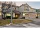 Two-story house with three-car garage and landscaped yard at 10825 Bernini Dr, Las Vegas, NV 89141