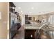 Large kitchen island with granite countertops and stainless steel appliances at 10825 Bernini Dr, Las Vegas, NV 89141